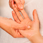 Therapist performing arthritis hand massage to ease joint stiffness and promote comfort at Spirit & Body Massage Prescott Valley