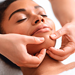 Therapist performing connective tissue massage on jaw area to relieve TMJ tension and improve comfort at Spirit & Body Massage Prescott Valley
