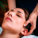 Therapist performing craniosacral massage on client’s head to relieve tension and promote deep relaxation at Spirit & Body Massage Prescott Valley