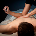 Therapist performing deep tissue massage on client’s back to relieve muscle tension and promote recovery at Spirit & Body Massage Prescott Valley