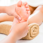 Therapist performing reflexology foot massage to relieve stress and promote whole-body balance at Spirit & Body Massage Prescott Valley