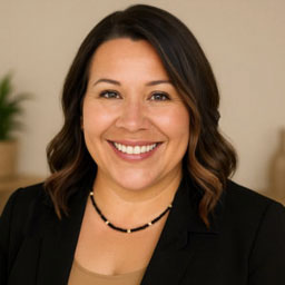 Portrait of Linda Morris, co-owner of Spirit & Body Massage Prescott Valley, smiling warmly in a neutral spa setting — representing her compassionate, intuitive approach to lasting relief and healing massage.