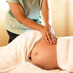 Therapist performing prenatal massage to support comfort and relaxation during pregnancy at Spirit & Body Massage Prescott Valley