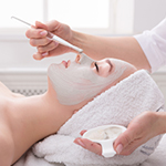 Client receiving a relaxing facial mask application during the Signature Facial at Spirit & Body Massage in Prescott Valley, Arizona.